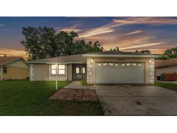 Charming single-story home featuring an attached two-car garage and a well-maintained front yard at 6406 Butternut Dr, Lakeland, FL 33813