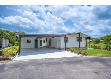 Charming single-story home featuring a carport and well-maintained landscaping at 2055 S Floral Ave # 245, Bartow, FL 33830