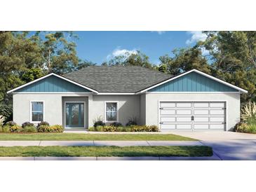 Charming single-story home with manicured lawn and a two-car garage, complemented by mature landscaping at 362 Oliver Dr, New Smyrna Beach, FL 32168
