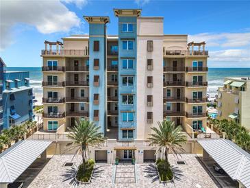 Stunning oceanfront condo building featuring private balconies and lush landscaping at 807 S Atlantic Ave # 302, New Smyrna Beach, FL 32169