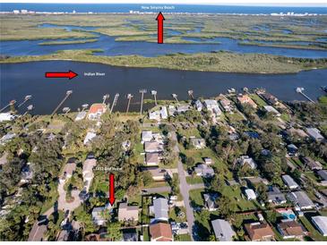 Wide aerial view of the property at 1312 2nd Street close to the Indian River and New Smyrna Beach at 1312 2Nd St, Edgewater, FL 32132