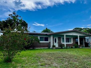 Charming single-story home with brick accents and well-maintained front lawn at 1119 Edith Dr, Daytona Beach, FL 32117