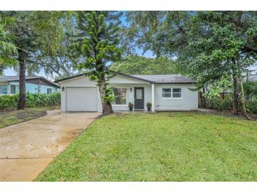 Newly renovated home with a modern facade and well-manicured lawn at 798 E 11Th Ave, New Smyrna Beach, FL 32169