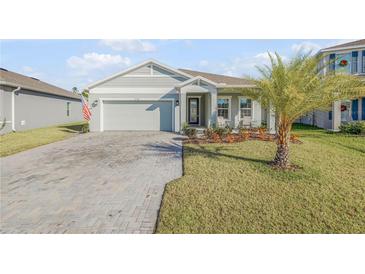 Charming single-Gathering home with a manicured lawn and a brick driveway, located in a desirable community at 270 Eagle Harbor Way, Daytona Beach, FL 32124
