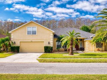 Beautiful two-story home with landscaped yard and attached garage at 6812 Stoneheath Ln, Port Orange, FL 32128