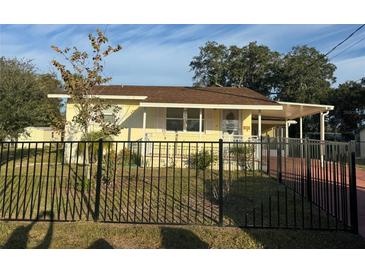 Cute yellow house with a fenced yard at 109 Western Ave, Edgewater, FL 32132