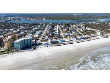 Aerial view of beach house near the ocean at 239 Kirkland Rd, New Smyrna Beach, FL 32169