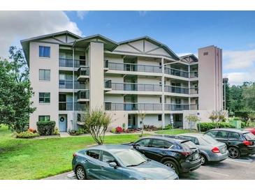 Condo building exterior with parking and landscaping at 1036 Bonaire Dr # 2832, Altamonte Springs, FL 32714