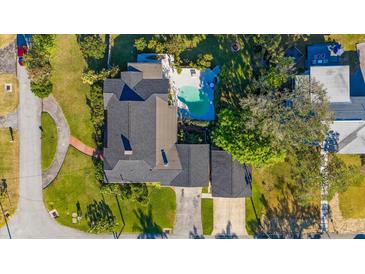 Aerial view of a single-Gathering home with pool and detached garage at 12 Foster Dr, Daytona Beach, FL 32118