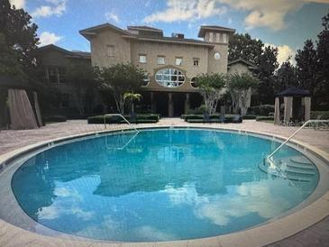 Resort-style pool with surrounding patio and building view at 126 Vista Verdi Cir # 204, Lake Mary, FL 32746