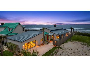 Oceanfront home with attached garage and modern architecture at 1309 Hill St, New Smyrna Beach, FL 32169