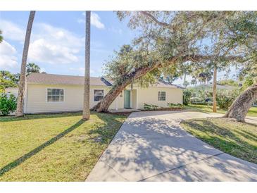 Charming single story home with a spacious driveway and lush landscaping at 142 Jean Francis Ln, Port Orange, FL 32127