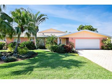 Attractive single-story home with landscaped yard and two-car garage at 236 Quay Assisi, New Smyrna Beach, FL 32169