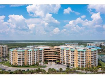 Aerial view of a large condominium complex with ocean views at 4650 Links Village Dr # D703, Ponce Inlet, FL 32127