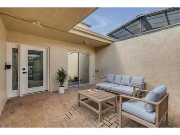 This charming brick patio features skylights and comfortable seating, perfect for relaxing or entertaining outdoors at 632 Sausalito Blvd, Casselberry, FL 32707