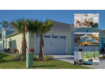 Charming home featuring a two-car garage and a beautifully landscaped front yard with palm trees at 667 Margaritaville Ave, Daytona Beach, FL 32124