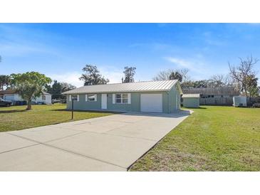 Newly renovated single story home with metal roof and large backyard at 1852 Sabal Palm Dr, Edgewater, FL 32141