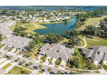 Aerial view of a beautiful home in a golf course community at 1938 Turnbull Lakes Dr, New Smyrna Beach, FL 32168