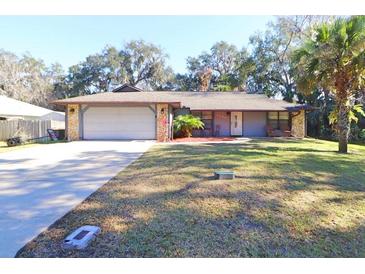 Ranch style home with attached garage and spacious yard at 2309 Lime Tree Dr, Edgewater, FL 32141