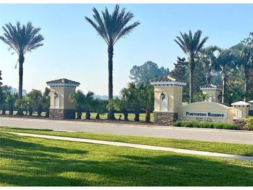 Portofino Reserve entrance with lush landscaping and decorative signage at 2824 S Asciano Ct, New Smyrna Beach, FL 32168