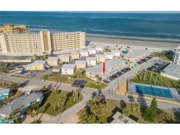 Aerial view showcasing condo building and beach location at 505 N Atlantic Ave # 29, New Smyrna Beach, FL 32169