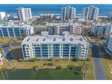 Aerial view of coastal condo community with oceanfront location and resort-style amenities at 5300 S Atlantic Ave # 15-401, New Smyrna Beach, FL 32169