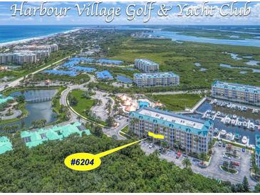 Aerial view of Harbour Village community, highlighting building #6204 near marina at 4623 Rivers Edge Village Ln # 6204, Ponce Inlet, FL 32127