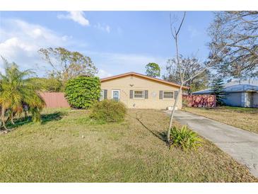 Charming single-story home featuring a well-maintained yard and classic curb appeal at 2323 Queen Palm Dr, Edgewater, FL 32141