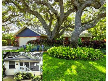 Charming home with mature trees, colorful landscaping, and well-maintained lawn at 4426 Saxon Dr, New Smyrna Beach, FL 32169