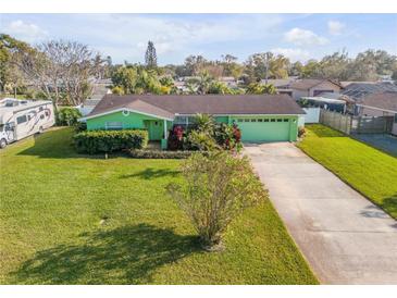 Charming green single-story home with well-manicured lawn and inviting curb appeal at 921 Duncan Rd, South Daytona, FL 32119