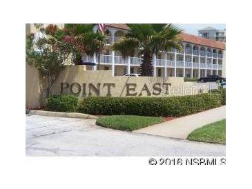 Well-maintained condominium complex with beautiful landscaping and mature trees at 3801 S Atlantic Ave # Ut125, New Smyrna Beach, FL 32169
