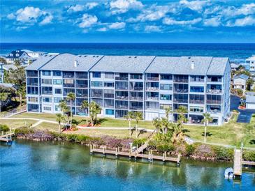 Condominium exterior view showing multiple units, decks and ocean views at 6584 Engram Rd # 405, New Smyrna Beach, FL 32169