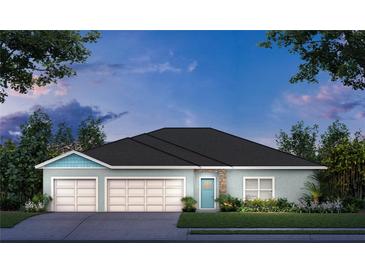 Charming single-story home featuring a two-car garage, stone accents, and a beautifully landscaped front yard at 1911 Lime Tree Dr, Edgewater, FL 32141