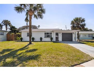 Charming single-story home with a well-manicured lawn and inviting curb appeal at 38 Seacrest Dr, Ormond Beach, FL 32176