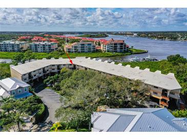Spacious waterfront condo boasts beautiful views, lush trees, and convenient parking at 520 S Peninsula Ave # 2C7, New Smyrna Beach, FL 32169