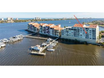 Stunning aerial view of waterfront property with boat docks and a view of the city skyline at 533 Marina Point Dr # 533, Daytona Beach, FL 32114