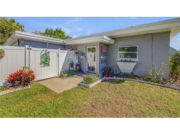 Charming single story home with a well manicured lawn and welcoming entrance at 312 Jefferson Ave, Port Orange, FL 32127