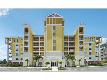 Stunning, multi-story condominium building with covered patios and manicured landscaping at 7 Riverwalk Dr # 206, New Smyrna Beach, FL 32169