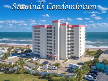 Seawinds Condominium complex with ocean views, lush landscaping, and convenient parking at 1183 Ocean Shore Blvd # 902, Ormond Beach, FL 32176