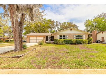 Charming single-story home with a well-maintained lawn and mature trees offering shade at 3635 Scott St, Port Orange, FL 32129