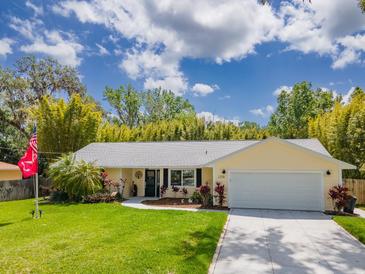 Charming single-story home with a well-manicured lawn and a two-car garage at 2236 Davis Dr, New Smyrna Beach, FL 32168