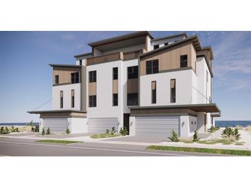 Beautifully designed three-story condo featuring a balcony, modern finishes and an attached garage at 3403 S Atlantic Ave # 3, New Smyrna Beach, FL 32169