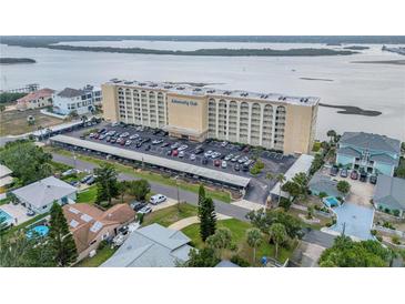 Aerial view of the Admiralty Club condo building with covered parking and beautiful waterfront views at 3606 S Peninsula Dr # 509, Port Orange, FL 32127
