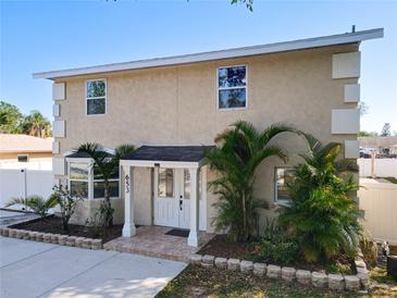 Charming two-story home with well-maintained landscaping and a welcoming front entrance at 653 Sweetwood Dr, Port Orange, FL 32127