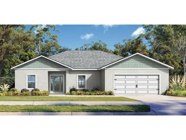 Charming single-story home with a two-car garage, manicured lawn, and beautiful landscaping at 377 Palm Dr, New Smyrna Beach, FL 32168