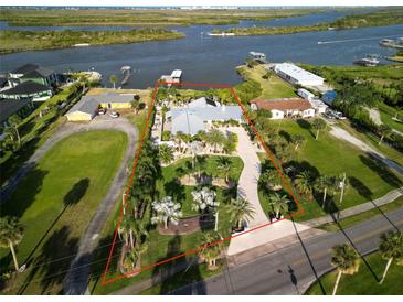 Gorgeous waterfront home with lush landscaping, private boat dock and city views at 1601 S Riverside Dr, Edgewater, FL 32132