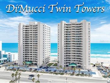 DiMucci Twin Towers oceanfront condos with beautiful views of the beach, palm trees, and coastal highway at 3311 S Atlantic Ave # 801, Daytona Beach, FL 32118