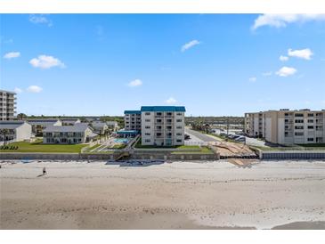 Stunning beachfront condo with ocean views, a pool, and ample parking for residents and guests at 4201 S Atlantic Ave # 402, New Smyrna Beach, FL 32169