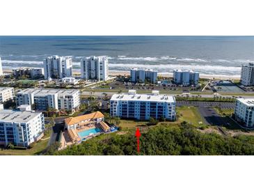 Coastal condominiums offer beach access with a pool and tennis courts at 5300 S Atlantic Ave # 17-207, New Smyrna Beach, FL 32169