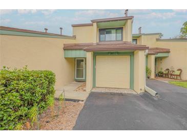 Inviting home featuring a one-car garage and manicured landscaping at 257 Club House Blvd, New Smyrna Beach, FL 32168